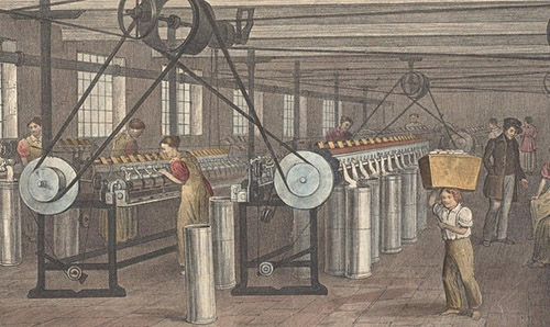 An industrial-era cotton mill with workers, including women and children, operating spinning machines driven by overhead belts.