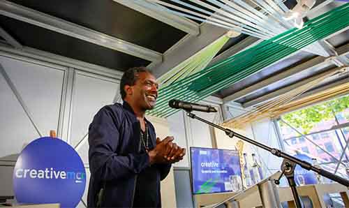 Lemn Sissay speaking at a poetry event